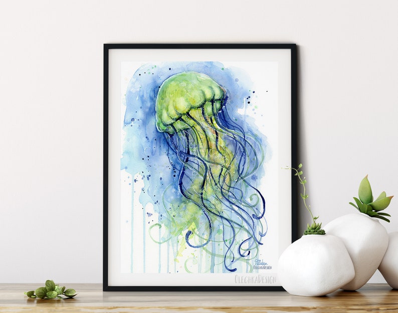 May include: Watercolor painting of a green jellyfish with blue tentacles against a blue and white background. The painting has a watercolor drip effect.