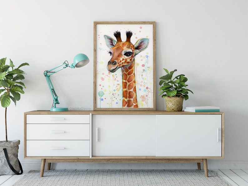 May include: A watercolor painting of a giraffe's head with a light brown and orange spotted pattern. The background is a light blue with white and pink dots.