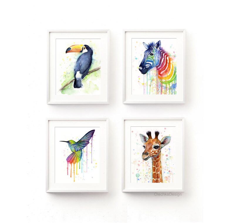 May include: Set of four watercolor animal prints featuring a toucan, zebra, hummingbird, and giraffe. Each animal is depicted in a colorful, abstract style with splashes of paint.