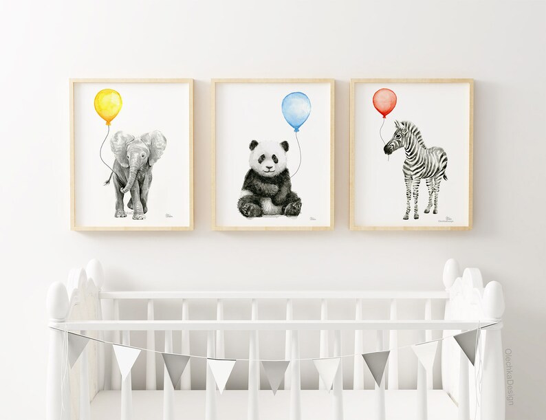 May include: Three framed prints of black and white animal illustrations with balloons. The first print features an elephant with a yellow balloon, the second print features a panda with a blue balloon, and the third print features a zebra with a red balloon.