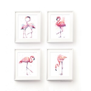 May include: Set of four watercolor paintings featuring pink flamingos in various poses. The paintings are framed in white frames and displayed on a white wall.