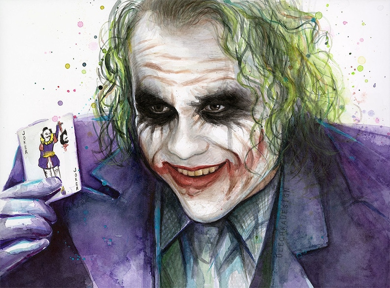 May include: Watercolour painting of the Joker from the film The Dark Knight. He is holding a playing card with the Joker on it. The background is white with colourful splatters of paint.