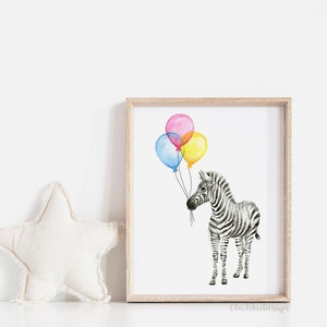 May include: Watercolor print of a zebra holding three colorful balloons. The balloons are pink, yellow, and blue. The zebra is black and white with a light brown wooden frame. The print is on a white background.