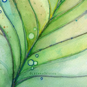 May include: Abstract watercolor painting of a green leaf with blue and yellow accents. The leaf is painted in a layered style, with the veins and edges of the leaf visible. The painting is signed "OLECHKADESIGN" in the lower right corner.