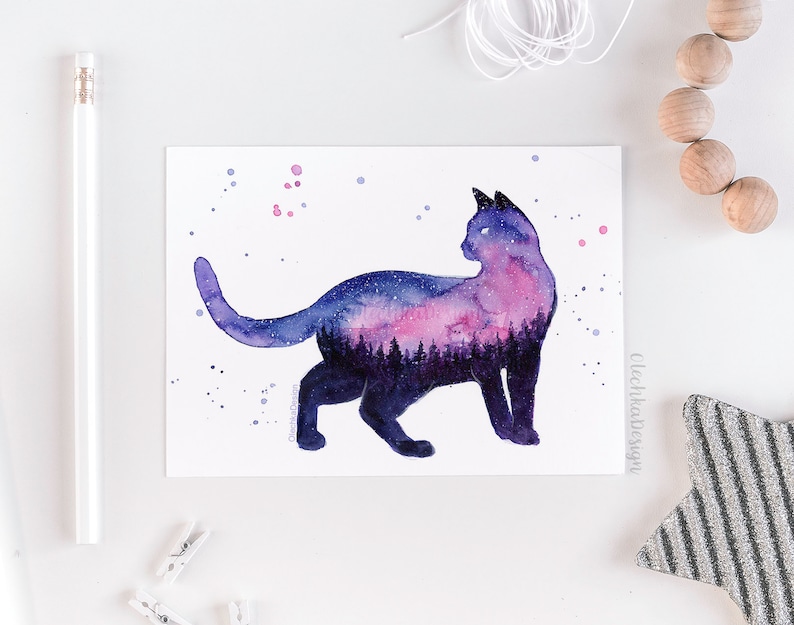 May include: Watercolor painting of a black cat silhouette with a galaxy inside. The galaxy is a mix of purple, pink, and blue colors with white stars. The cat is looking to the right.