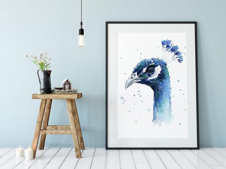 May include: Watercolor painting of a peacock's head in shades of blue and green, with a white background and green watercolor splatters.