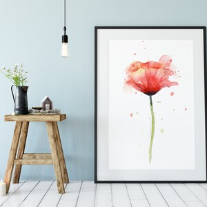 May include: A watercolor painting of a single red poppy flower with a green stem and leaves. The background is white with light pink and green watercolor splatters.
