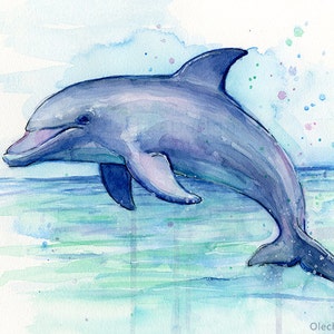May include: Watercolor painting of a dolphin jumping out of the water. The dolphin is painted in shades of blue and purple, with a white background. The water is painted in shades of blue and green.