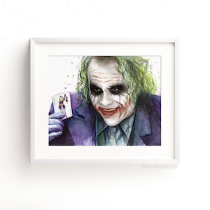 May include: Watercolor painting of the Joker from the movie The Dark Knight. He is holding a playing card with a Joker on it. The background is white with colorful splatters.