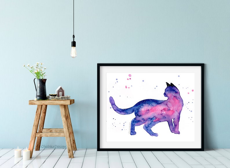May include: Watercolor painting of a cat silhouette with a galaxy inside. The cat is facing right and has a pink and purple galaxy inside its body. The background is white with pink and purple dots.