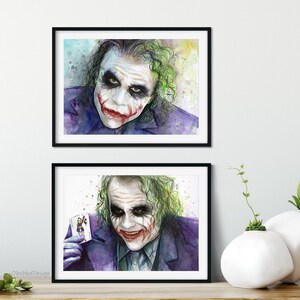May include: Two watercolour paintings of the Joker from the film The Dark Knight. The first painting shows the Joker's face with a sinister smile. The second painting shows the Joker holding a playing card with the Joker's face on it.