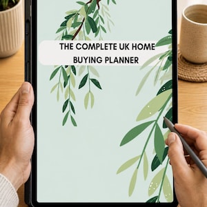 May include: A digital tablet displaying a planner titled THE COMPLETE UK HOME BUYING PLANNER on a light green background with illustrated green olive branches and leaves hanging from the top and sides of the screen.