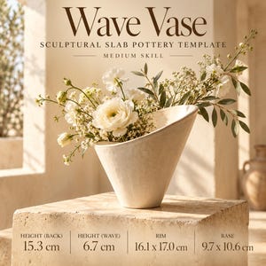 May include: A white ceramic wave vase containing white flowers. Text reads: Wave Vase, Sculptural Slab Pottery Template, Medium Skill. Dimensions: Height (back) 15.3 cm, Height (wave) 6.7 cm, Rim 16.1 x 17.0 cm, Base 9.7 x 10.6 cm.