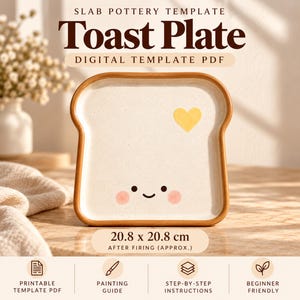 May include: A digital PDF slab pottery template for a toast-shaped plate. The plate is off-white with a brown rim, a yellow heart, and a smiling face with pink cheeks. Text reads: SLAB POTTERY TEMPLATE Toast Plate DIGITAL TEMPLATE PDF 20.8 x 20.8 cm.