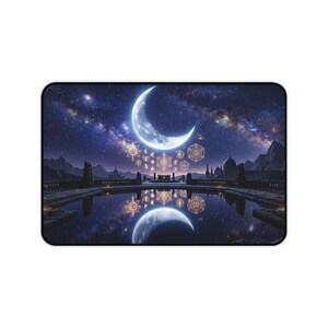 May include: A rectangular desk mat featuring a night sky with a large crescent moon and a starry galaxy above a dark landscape. A calm pool of water reflects the moon and glowing golden circular symbols that float in the air above the horizon.