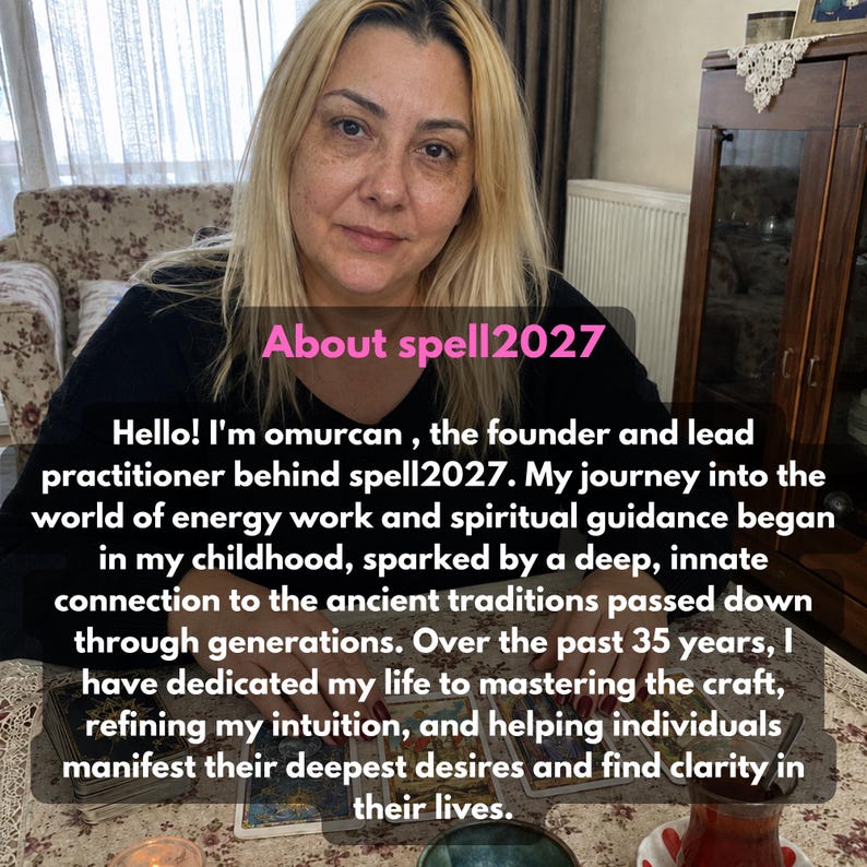 May include: A person with blonde hair wearing a black long-sleeved shirt sits at a table with tarot cards. Text overlay reads: About spell2027. Hello! I'm omurcan, the founder and lead practitioner behind spell2027. My journey into the world of energy work.