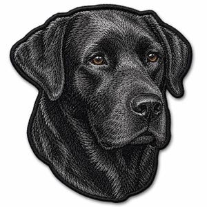 May include: An embroidered patch featuring the head of a black Labrador retriever. The design uses detailed black and grey thread to depict the dog's fur texture and facial features, including brown eyes and a black nose, with a solid black border.