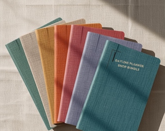 May include: A set of seven rectangular planners arranged in a fan shape, featuring textured covers in shades of teal, beige, yellow, orange, pink, lavender, and blue. The top blue planner displays the text DAYLINE PLANNER SHOP BUNDLE.