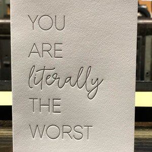 Vous êtes littéralement le pire message d'accueil typographique