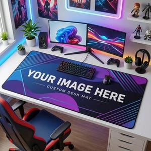 May include: A large rectangular desk mat featuring a gradient blue and purple abstract pattern with diagonal lines. The text "YOUR IMAGE HERE" and "CUSTOM DESK MAT" is printed in white in the center of the mat on a gaming desk setup.