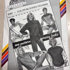 May include: A sewing pattern envelope for a color-blocked dolman top, labeled 5060, designed by Ann Person for Stretch & Sew. The cover features illustrations of four variations of the top, with text including 'one pattern many looks' and bust sizes 30-46.