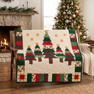 May include: A quilted throw blanket featuring a central design of five stylized Christmas trees in shades of green, red, and plaid, accented with gold stars on a cream background. The border consists of alternating red, green, and plaid fabric blocks.