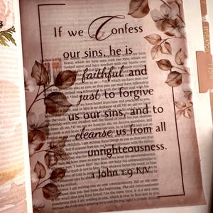 May include: A page from a Bible featuring the text If we confess our sins, he is faithful and just to forgive us our sins, and to cleanse us from all unrighteousness. 1 John 1:9 KJV, decorated with brown floral illustrations and leaves.