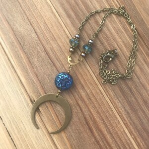 Iridescent blue crystal and gold moon necklace