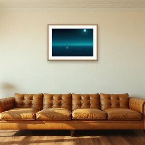May include: A rectangular framed wall art print featuring a dark blue night seascape with a small boat on the water under a bright full moon. The artwork is displayed in a light wood frame and is centred on a plain off-white interior wall.