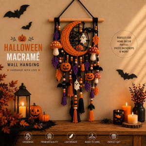 May include: A macrame wall hanging featuring a large orange crescent moon, crocheted pumpkins, ghosts, mushrooms, and purple and orange leaves suspended from a wooden dowel with black cord, wooden beads, and black tassels.