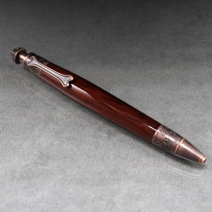 Cocobolo Holz Hundegehege mit geölter Bronze Verzierung