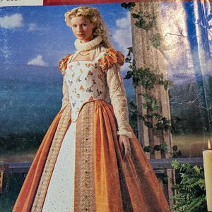 May include: A sewing pattern envelope titled Elizabethan Costume Collection featuring a gown with a white floral bodice, orange velvet skirt panels, long textured sleeves, a high ruffled collar, and gold trim accents on a blue and green landscape background.