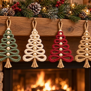 A cozy fireplace decorated with four knitted Christmas trees in various colors, including green, white, red, and beige, with pine cones and berries on the mantel.