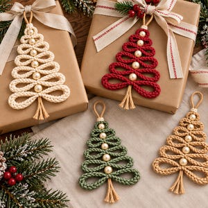 a festive arrangement of Christmas-themed ornaments, wrapped gifts, and holiday decorations. The ornaments are crafted from yarn and are designed to resemble Christmas trees, with a variety of colors and sizes. The wrapped gifts are placed on a wooden surface, and the overall scene conveys a warm and celebratory holiday atmosphere.