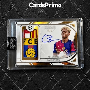 May include: A Topps Dynasty 1/1 trading card featuring Lamine Yamal in an FC Barcelona jersey. The card includes a match-worn memorabilia patch with the FC Barcelona crest and a blue ink autograph. It is encased in a clear protective plastic holder.