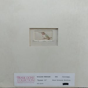 May include: A hand-colored etching of a hummingbird perched on a branch by William Wheeler, titled Hummer II, numbered 46/100. The artwork is mounted on a white mat board with a label from the Frank Lyons Collection detailing the piece.