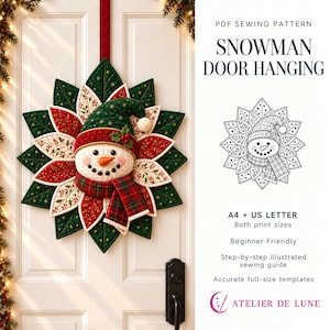 May include: A PDF sewing pattern for a snowman door hanging. The image shows a quilted snowman with a green hat and red plaid scarf, surrounded by green and red fabric leaves. Text includes "SNOWMAN DOOR HANGING", "A4 + US LETTER", and "ATELIER DE LUNE".
