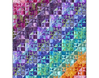 May include: A rectangular quilt featuring a grid of small square blocks arranged in a vibrant color gradient. The pattern transitions from deep pink and purple in the upper left corner to bright orange and yellow in the lower right corner.