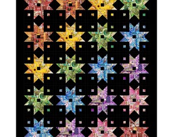 May include: A quilt featuring a grid of sixteen star-shaped blocks arranged in a rainbow color gradient. Each star is composed of various patterned fabric scraps in shades of red, orange, yellow, green, blue, and purple, all set against a solid black background with black sashing and borders.