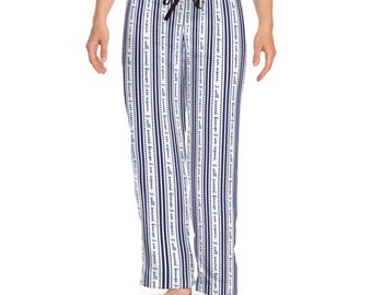 May include: White pajama pants featuring vertical navy blue stripes and a repeating script text pattern that reads, I will succeed because I am insane. The pants have a black drawstring at the elastic waistband and a straight-leg fit.