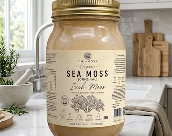 May include: A large glass jar filled with organic sea moss gel, topped with a gold metal lid. The beige label features the text Chi-Moss Organic Sea Moss Original Irish Moss, along with icons for smoothies, tea, coffee, and dressings.