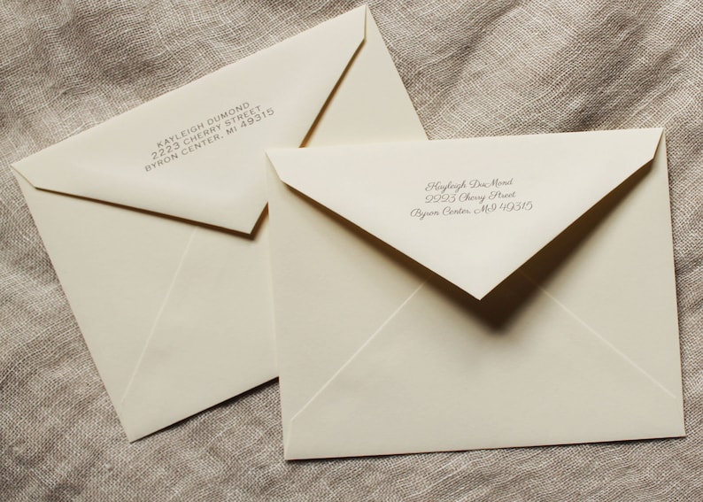 May include: Two white envelopes with handwritten addresses. The top envelope has the address Kayleigh Dumond, 2223 Cherry Street, Byron Center, MI 49315. The bottom envelope has the address Hayleigh Don Mond, 2923 Cherry Street, Byron Center, MI 49315.