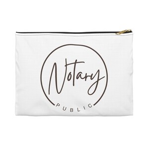 May include: A white rectangular zippered pouch featuring a dark brown circular graphic. Inside the circle, the word Notary is written in a cursive script font, with the word PUBLIC printed in a simple sans-serif font along the bottom curve.