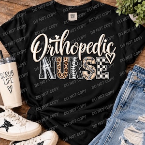 May include: A black t-shirt featuring the text Orthopedic NURSE in a stylized font. The word NURSE incorporates various patterns including a bone illustration, leopard print, a spinal column, medical hardware, and a black and white checkerboard.