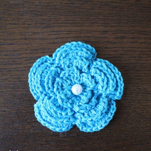 3D crochet flower in turquoise with pearl approx 8cm image 1
