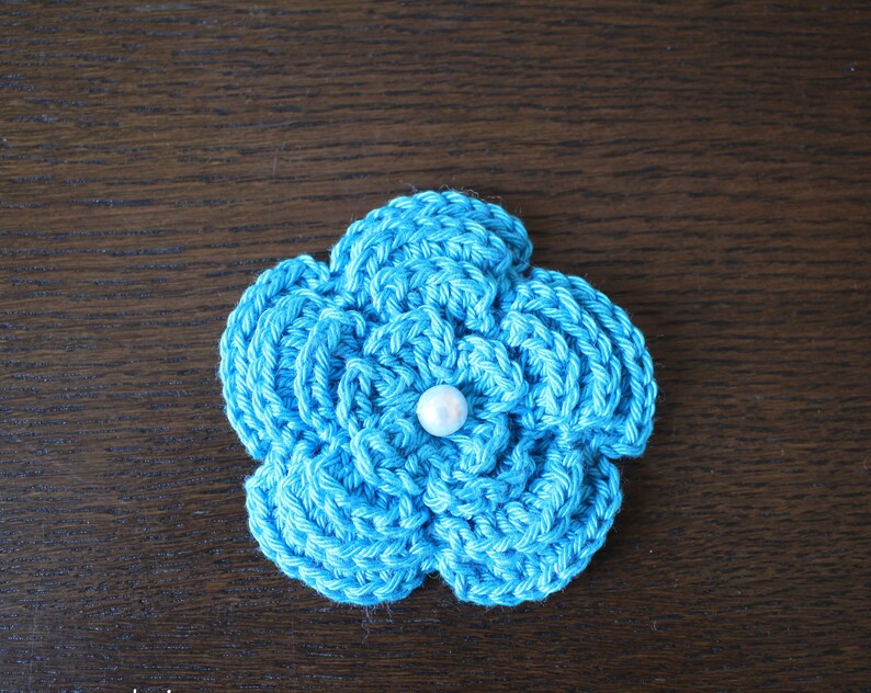 3D crochet flower in turquoise with pearl approx 8cm image 1