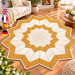 May include: A circular crochet rug featuring a star-shaped pattern in mustard yellow and cream white. The design radiates from a central point with alternating pointed segments, finished with a delicate white beaded edge along the entire perimeter.