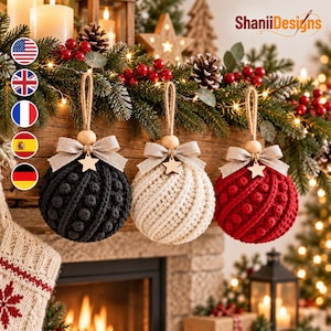 May include: Three round Christmas ornaments in black, cream, and red, each featuring a textured knit pattern with bobbles. Each ornament is topped with a beige fabric bow, a wooden star charm, and a natural jute twine loop for hanging.
