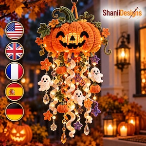 May include: A crocheted Halloween mobile featuring a large orange jack-o'-lantern top with a smiling face, adorned with small crocheted pumpkins, white ghosts, purple and orange flowers, spiral white ribbons, and clear crystal-like pendants.