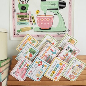 May include: A set of colourful recipe cards with illustrations and text. The cards feature phrases like "add a little spice to your", "wake up and smell the coffee", "let your lemons be sour and your words be sweet", and "much of our future lies in preserving our past".